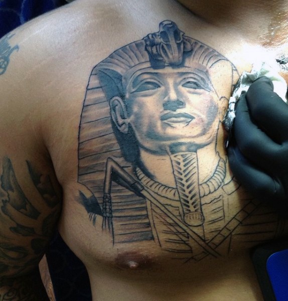 Unfinished black ink 3D like Pharaoh tattoo on chest