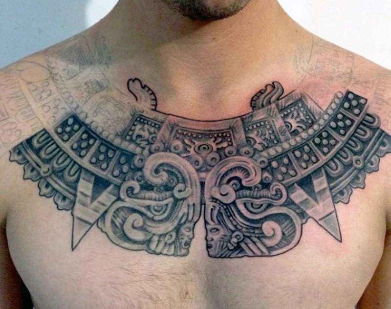 Unfinished black ink chest tattoo of Mayan ancient sculpture