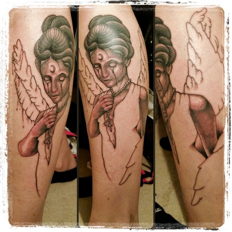Unfinished colored leg tattoo of mysterious angel with moon