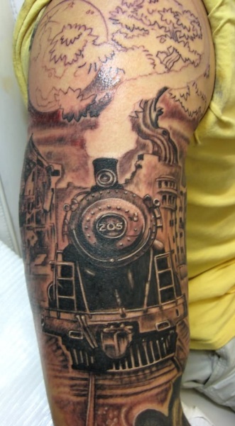 Unfinished enormous half sleeve tattoo of train combined with large tree