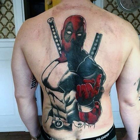 Unfinished half colored back tattoo of Deadpool with swords