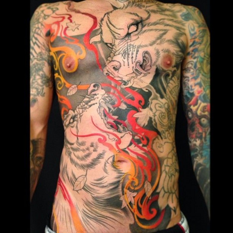 Unfinished half colored demonic dogs tattoo on chest stylized with flowers and flames