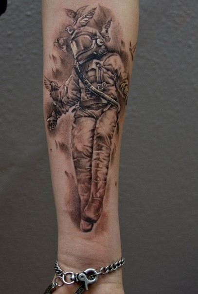 Unique black ink astronaut tattoo of forearm with pigeons