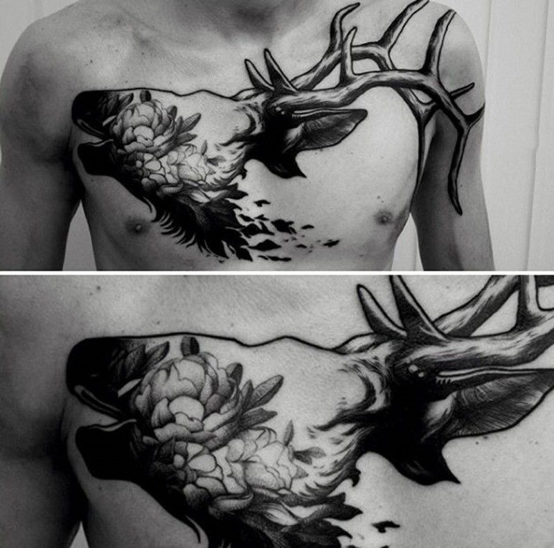 Unique black ink elk shaped chest tattoo stylized with wonderful flowers