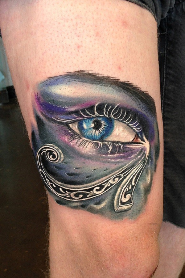 Unique colorful Eye of Horus shaped tattoo on thigh