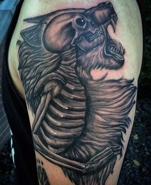 Unique designed and colored big black and white skeleton in animal fur tattoo on shoulder