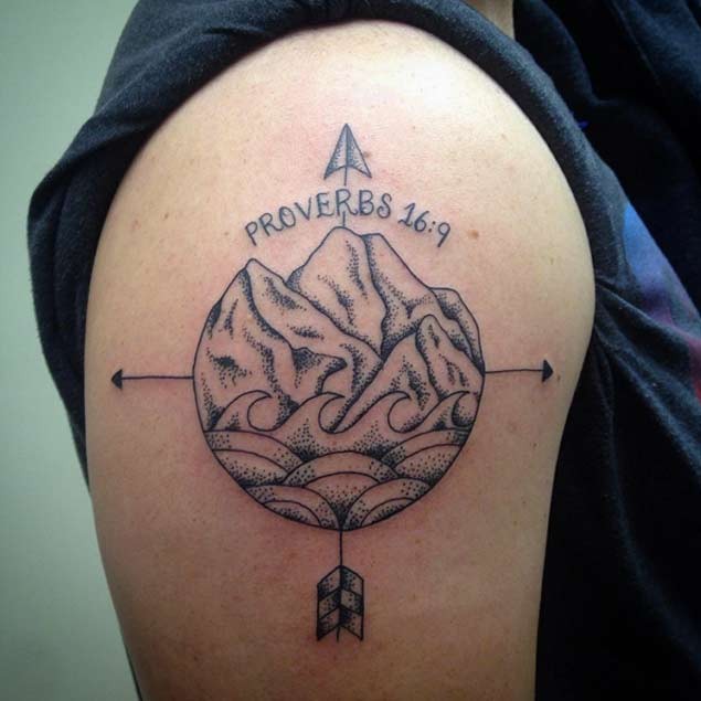 Unique designed black ink old school mountains with waves tattoo on shoulder stylized with arrows and lettering