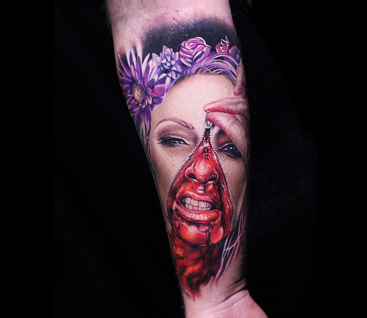 Unique designed colorful horror woman portrait tattoo of forearm stylized with flowers