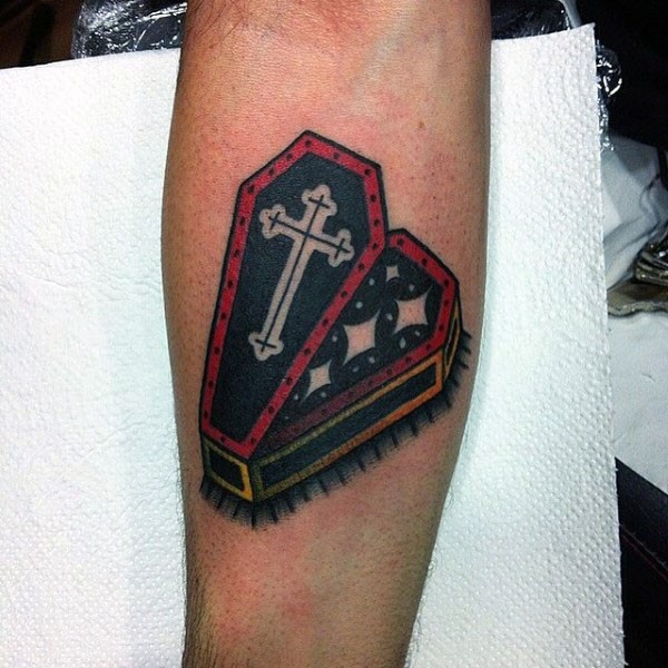 Unique designed little colored coffin tattoo on arm