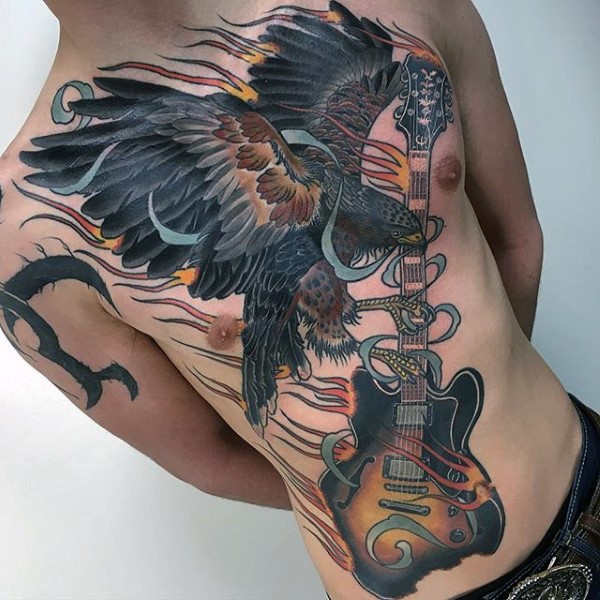 Unique designed very derailed colorful eagle with burning guitar tattoo on whole chest and belly
