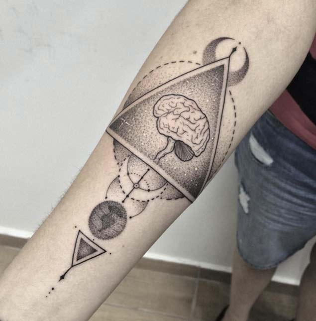 Unique original designed human brain tattoo on forearm stylized with cult figures