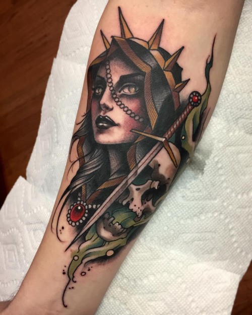 New school style colored forearm tattoo of creepy woman with skull and sword by Michael J Kelly