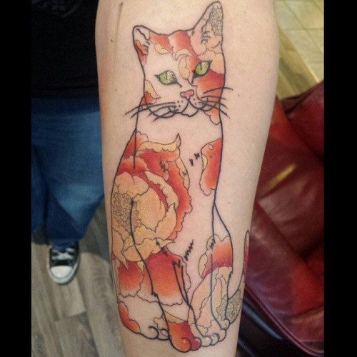 Illustrative style colored arm tattoo of cat stylized with various flowers