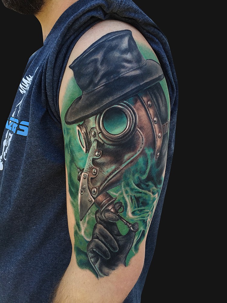 New school style colored shoulder tattoo of plague doctor with needle