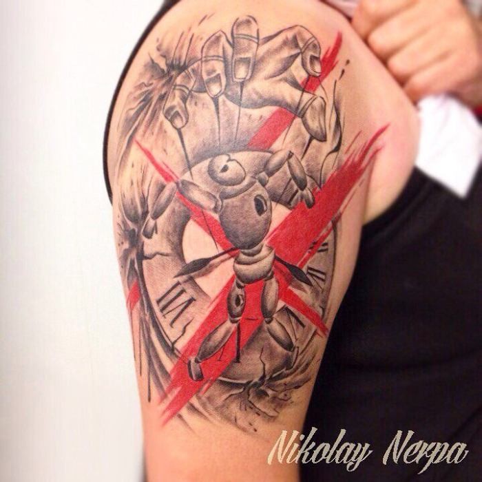 New school style colored shoulder tattoo of puppet with clock