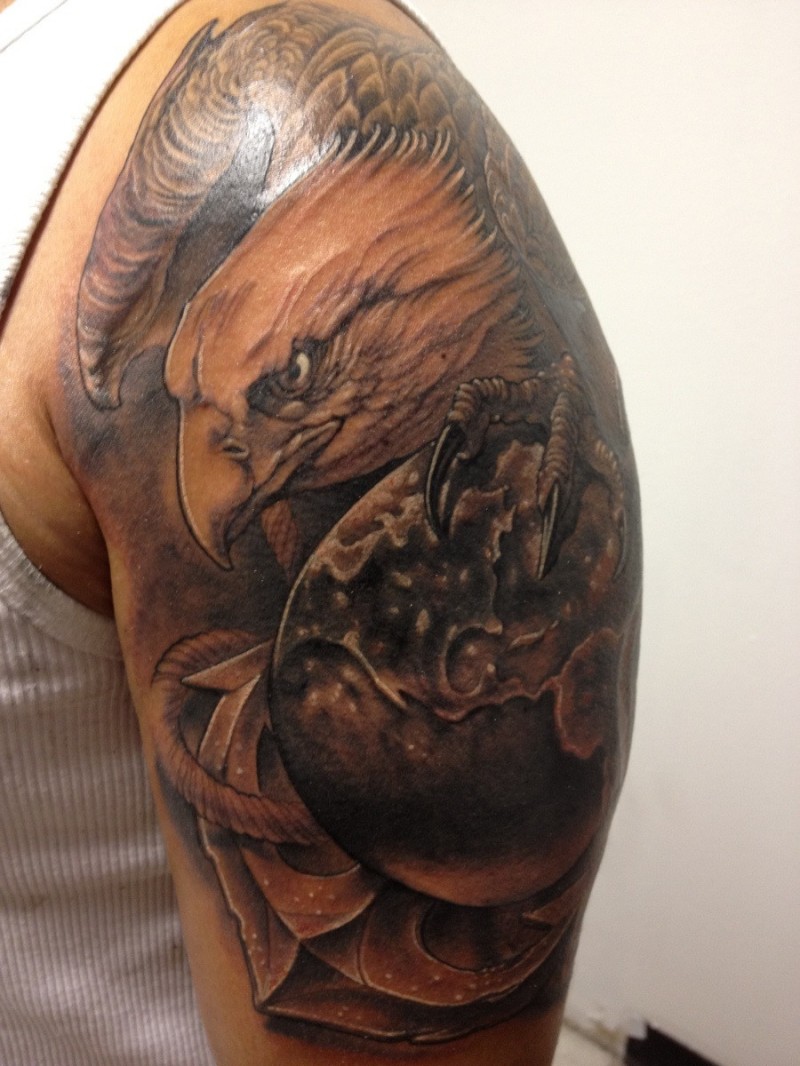 Illustrative style colored shoulder tattoo of eagle with globe and anchor