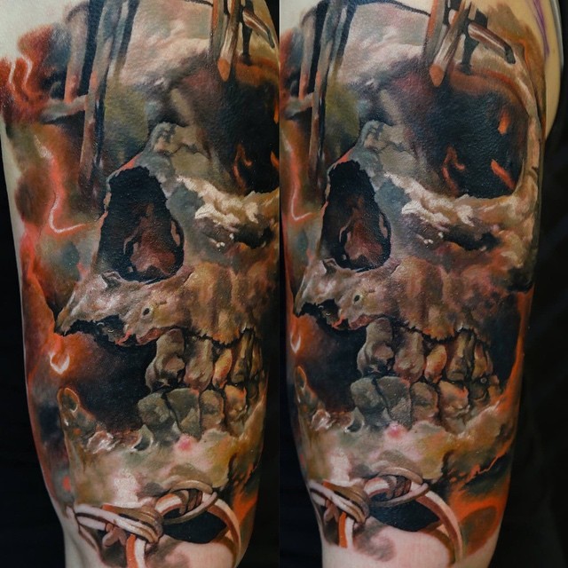 New school style colored shoulder tattoo of big human skull with vine