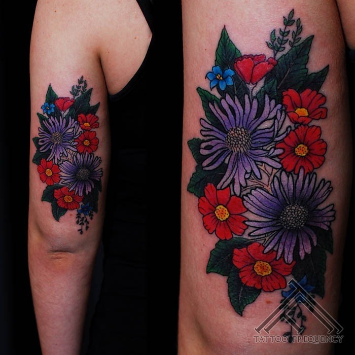 New school style colored arm tattoo of various wildflowers