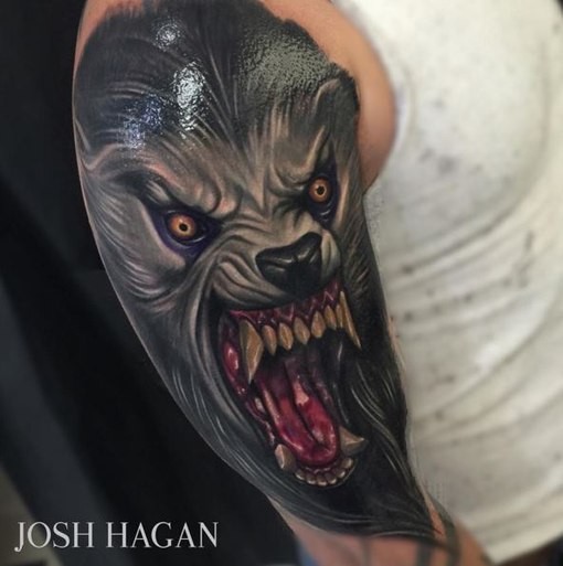 New school style colored shoulder tattoo of evil looking wolverine