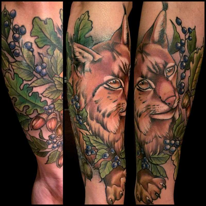 New school style colored arm tattoo of big wild cat with berries