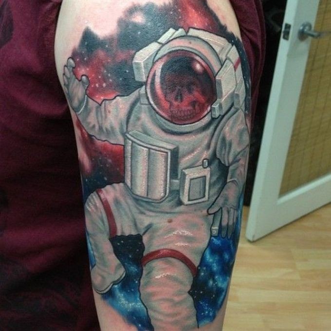 Illustrative style colored shoulder tattoo of astronaut skeleton