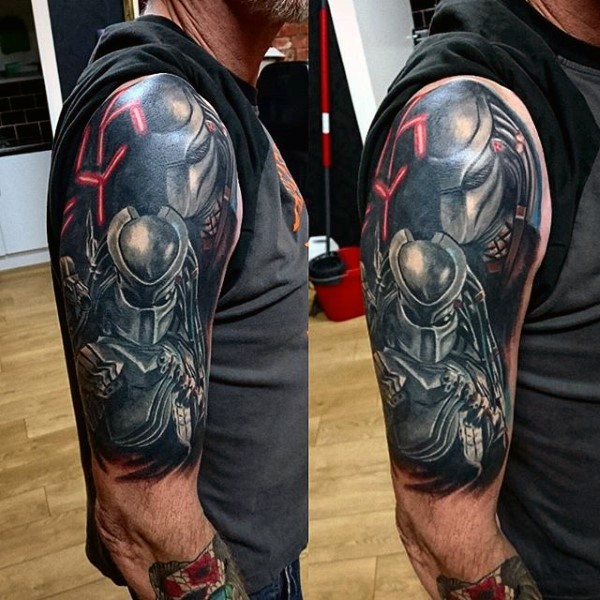 Illustrative style colored shoulder tattoo of Predator portrait