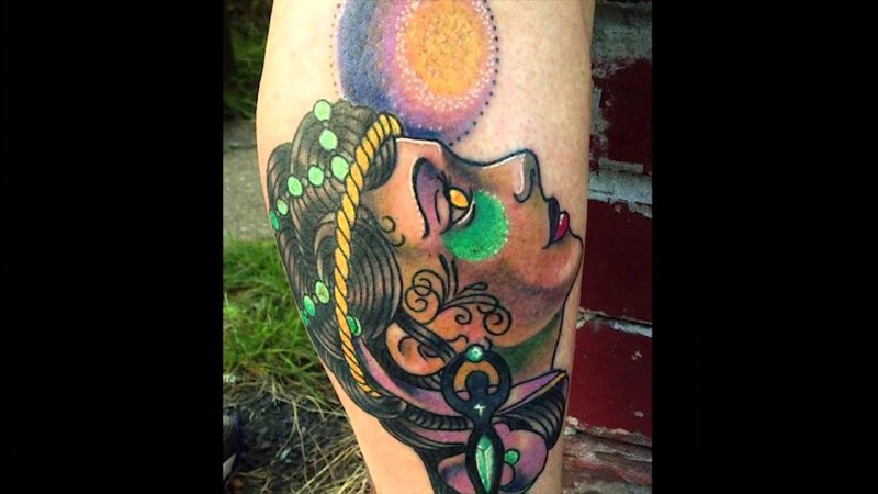 New school style colored leg tattoo of demonic woman face with planet