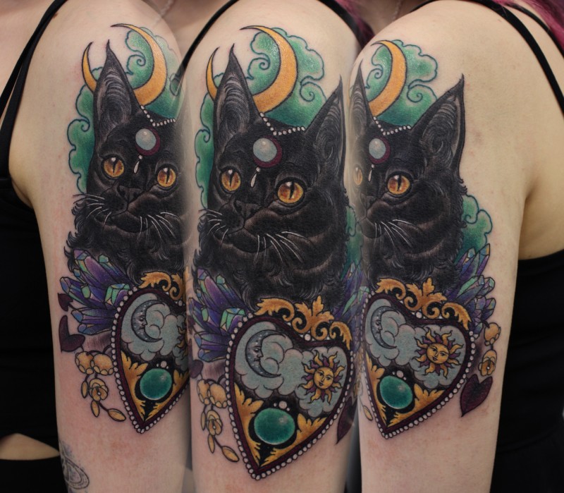 New school style colored shoulder tattoo of fantasy cat with jewelry