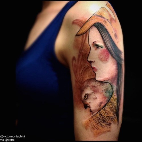 Illustrative style colored shoulder tattoo of woman with eagle