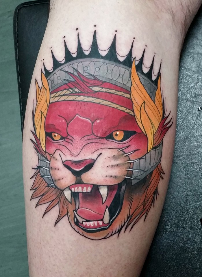 New school style colored leg tattoo of evil fantasy lion with crown