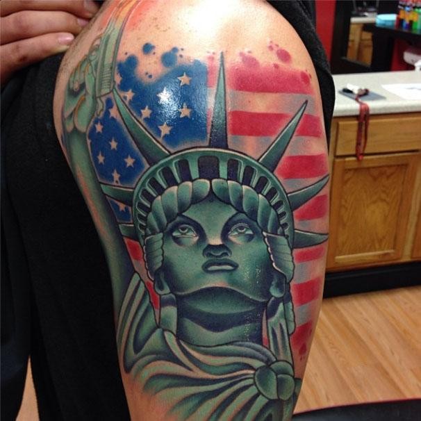 Illustrative style colored shoulder tattoo of Statue of Liberty