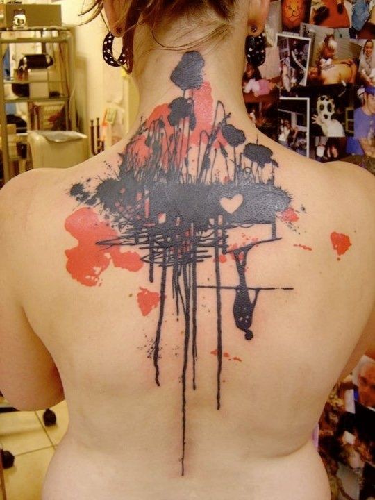 Unusual abstract style colored flowers with heart tattoo on upper back