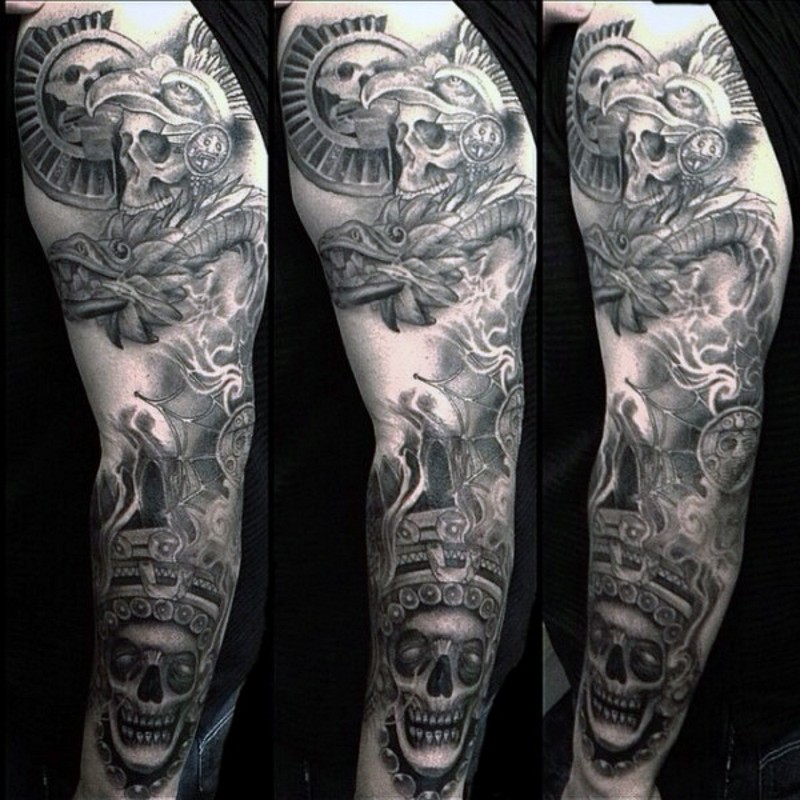 Unusual black and white sleeve tattoo of demonic skull and statues