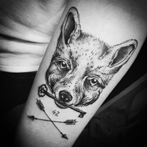 Unusual black ink fox with key tattoo on forearm combined with crossed arrows