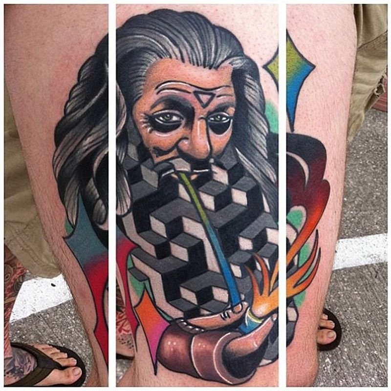 Unusual combined colorful mystical wizard with smoking pipe tattoo on thigh