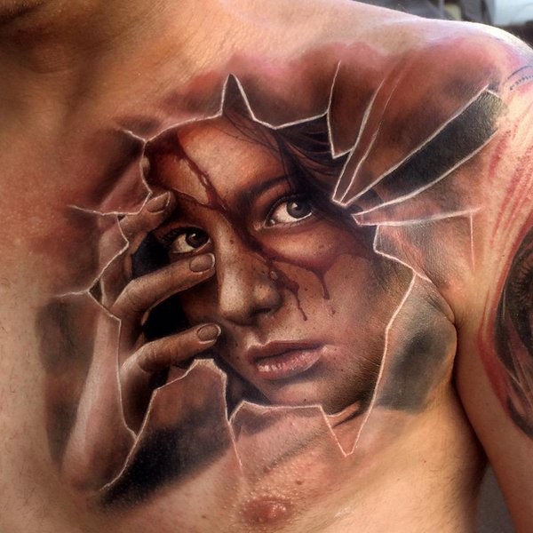 Unusual designed and colored chest tattoo of woman with broken glass