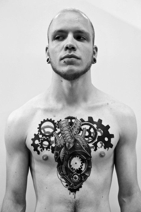 Unusual designed black and white chest tattoo of mechanical heart