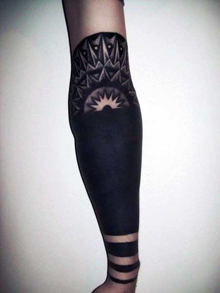 Unusual designed black and white tribal ornaments in arm