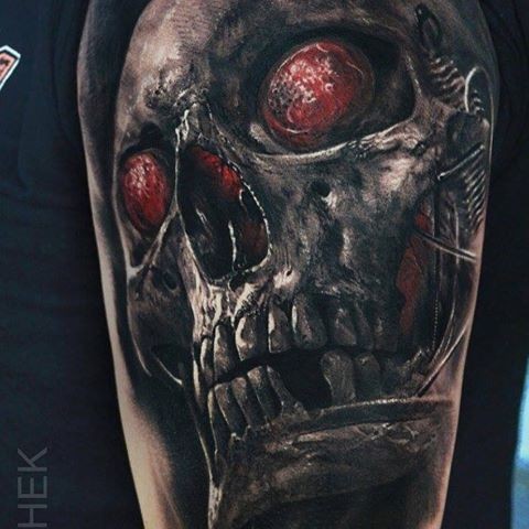 Insolito progettato da Eliot Kohek tatuaggio del braccio superiore del cranio con occhi sanguinanti