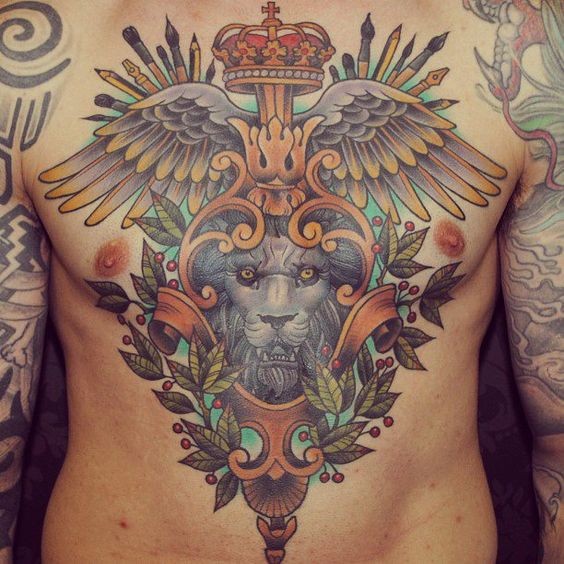 Unusual designed colored fantasy lion tattoo on chest combined with flowers and wings