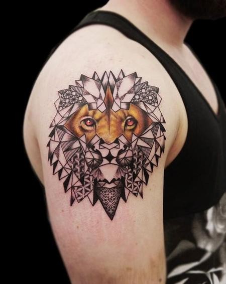 Unusual designed colored half real half ornaments lion tattoo on shoulder area