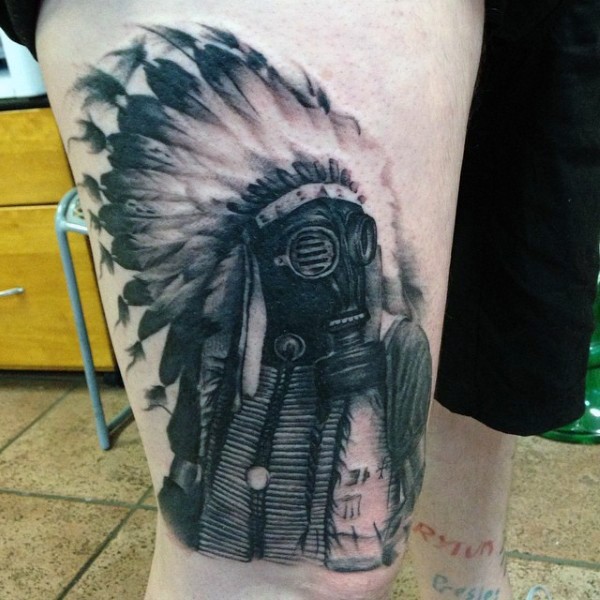 Unusual designed realism style Indian in gas mask tattoo on thigh