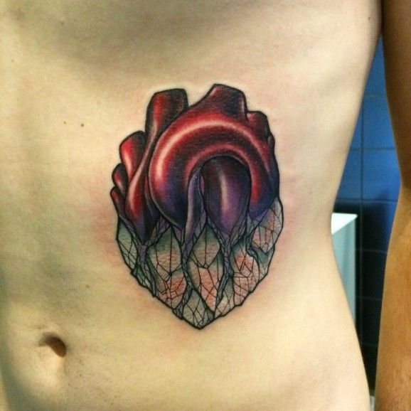 Unusual heart tattoo on ribs by Miss Juliet