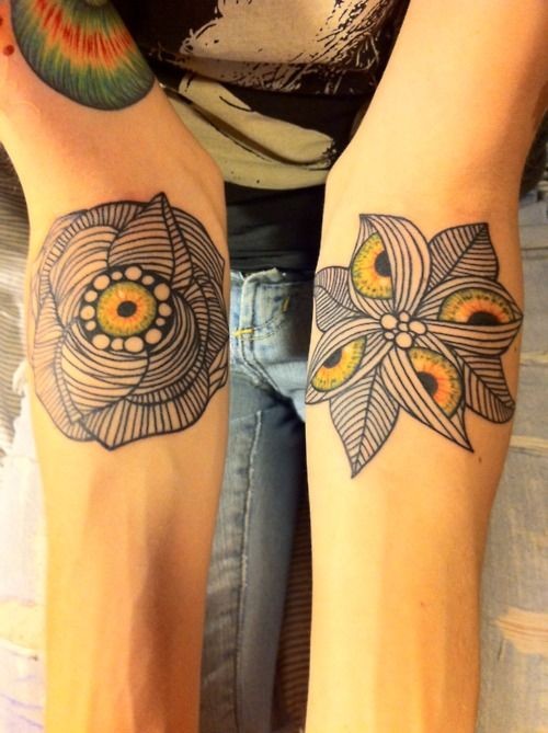 Unusual painted little colored mystical flowers tattoo on arms
