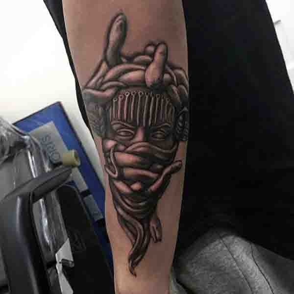 Unusual style 3D realistic Medusa tattoo on arm