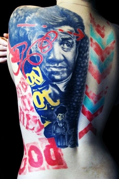 Unusual style big multicolored portrait with lettering tattoo on shoulder