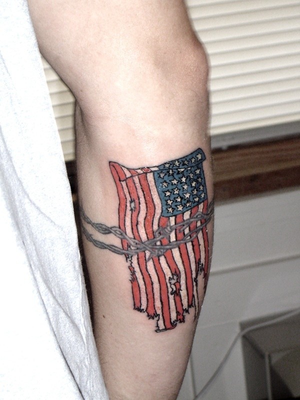 Usa flag with barbed wire tattoo on arm