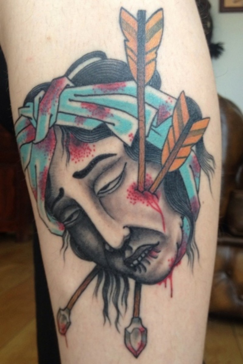 Usual Asian style colored sever head with arrows tattoo