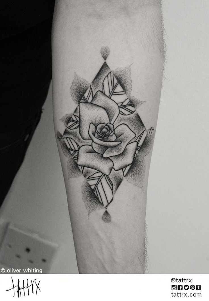 Usual black ink big geometrical figure tattoo on forearm stylized with rose