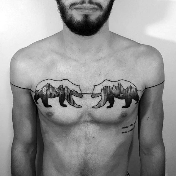 Usual black ink chest tattoo of bears stylized with mountains